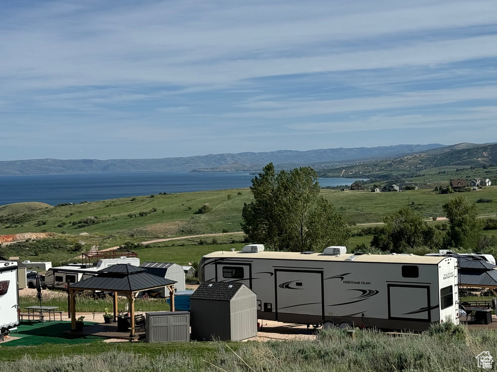Property view of mountains with a water view
