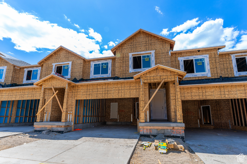 Property under construction with concrete driveway