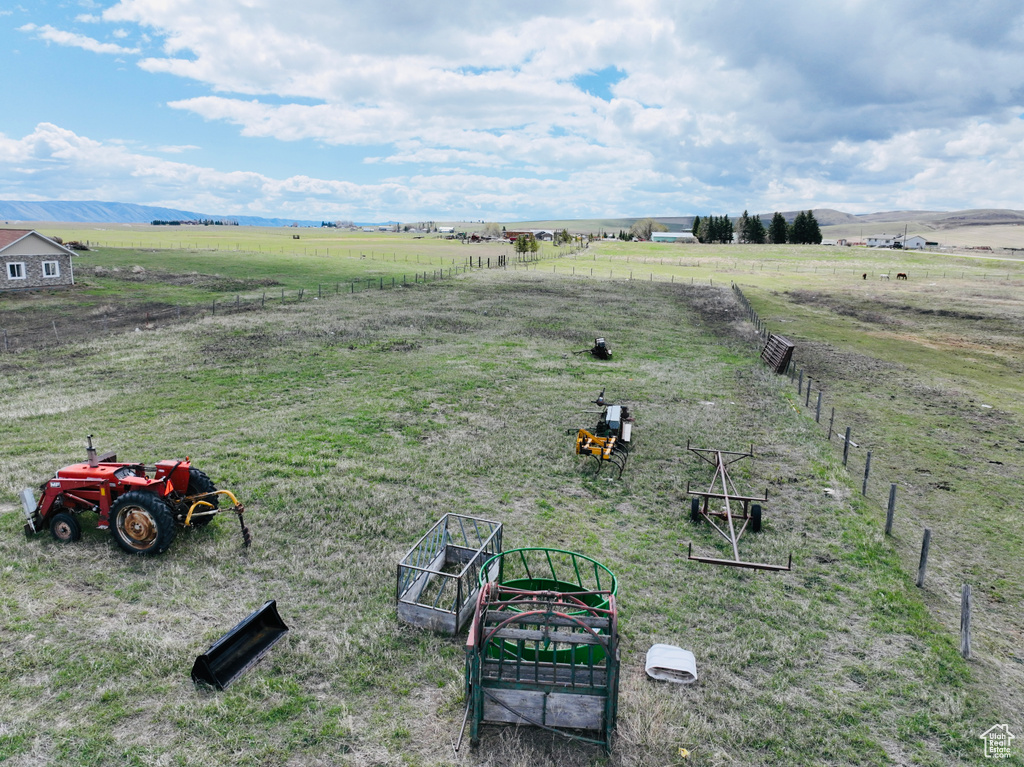 View of yard featuring a rural view and fence