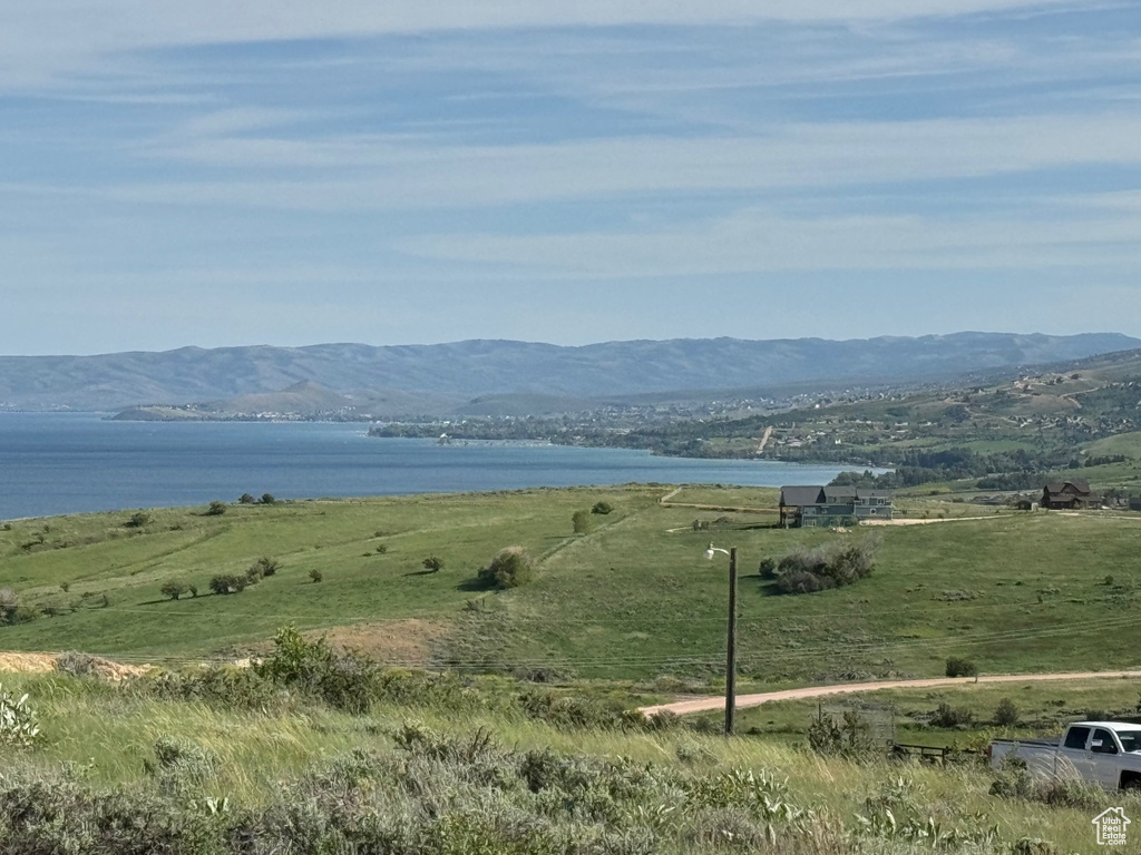 View of mountain feature with a water view and a rural view