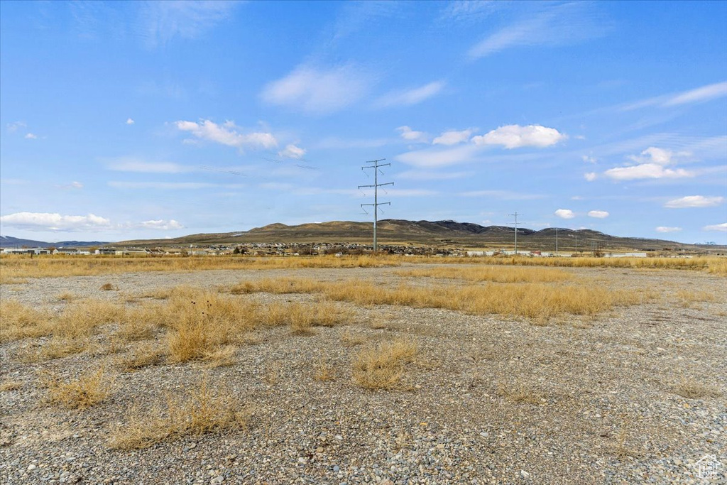Property view of mountains with a rural view