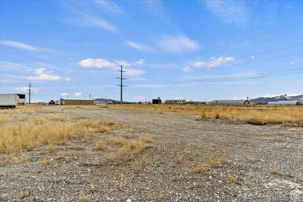 View of yard with a rural view