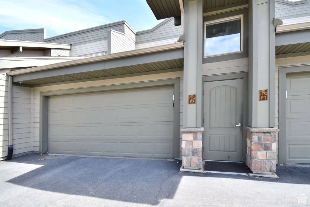 Garage featuring driveway