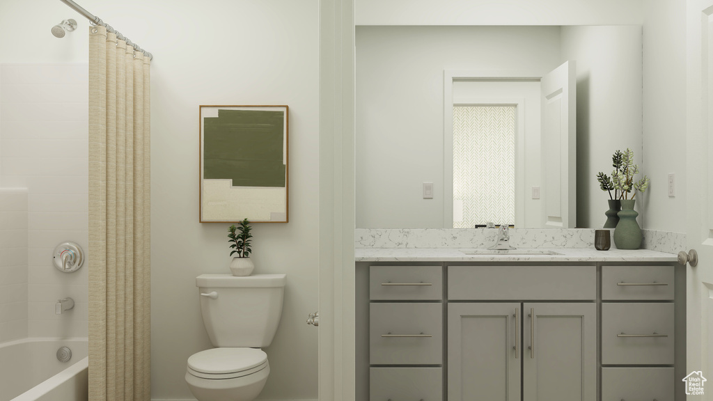 Bathroom with vanity, shower / tub combo with curtain, and toilet