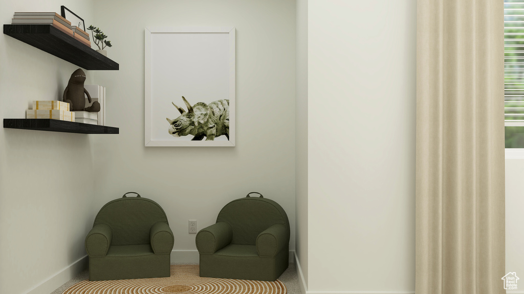 Sitting room featuring baseboards