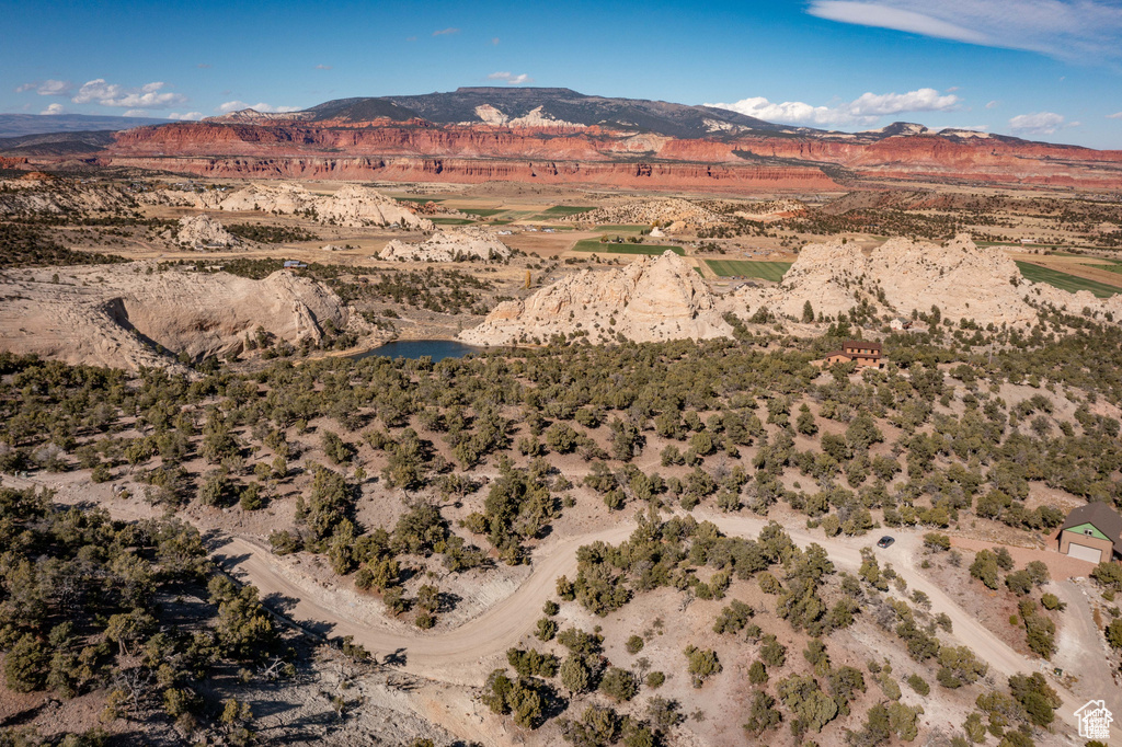 Birds eye view of property with a mountain view