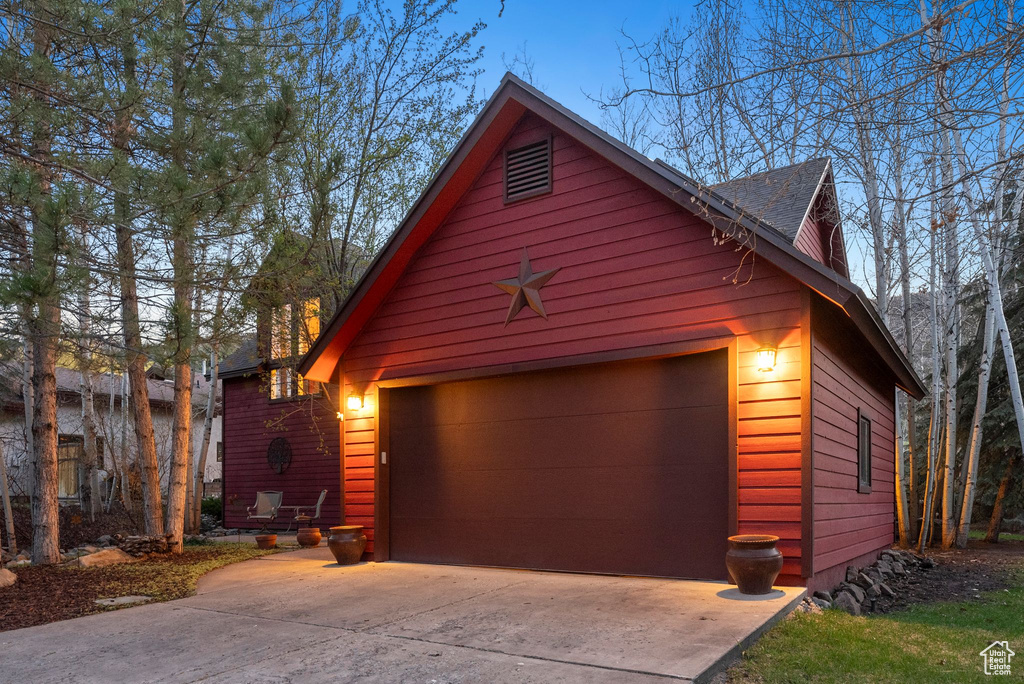 Garage with concrete driveway