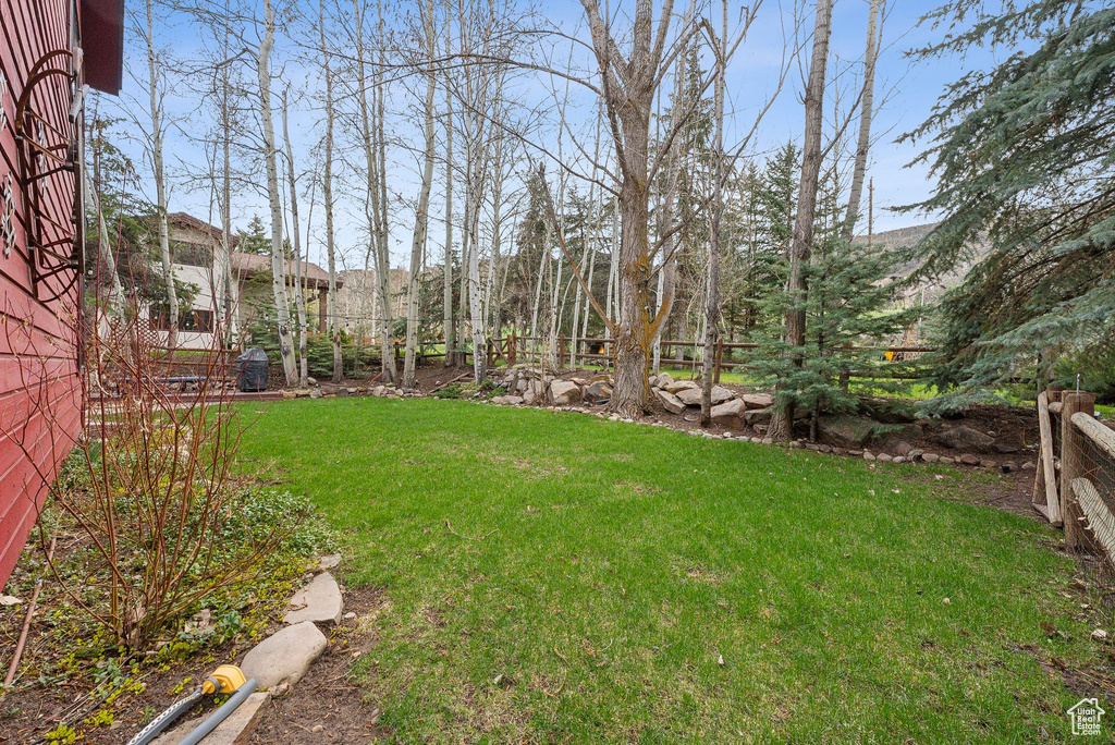View of yard featuring fence