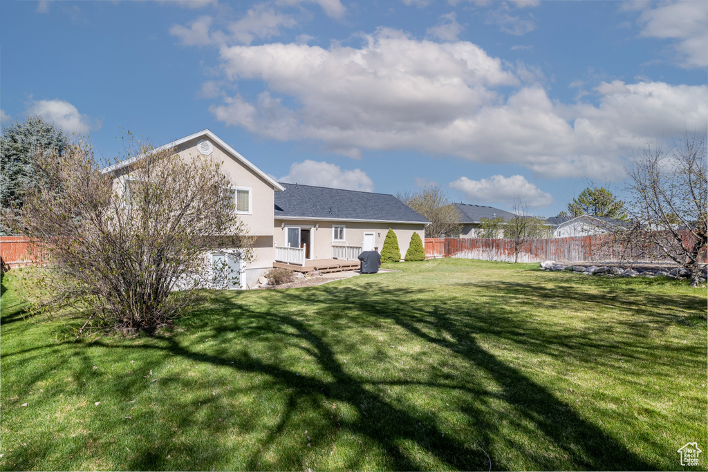 View of yard with fence