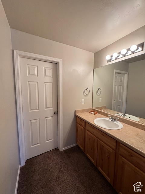 Bathroom with baseboards and vanity