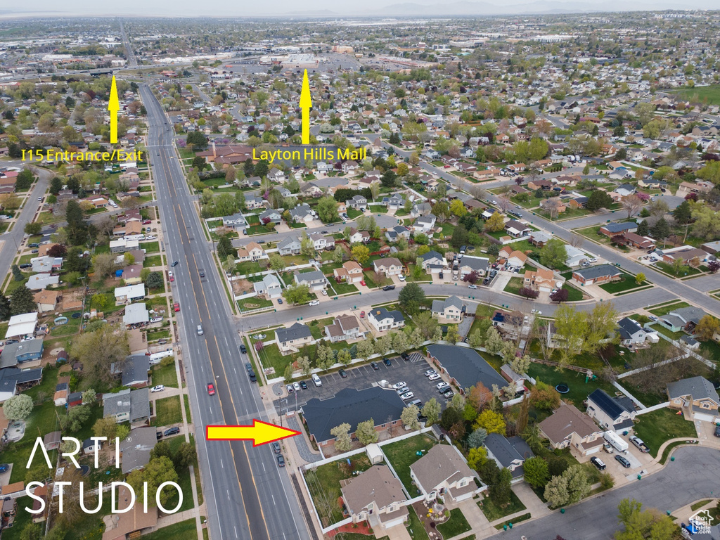 Birds eye view of property with a residential view