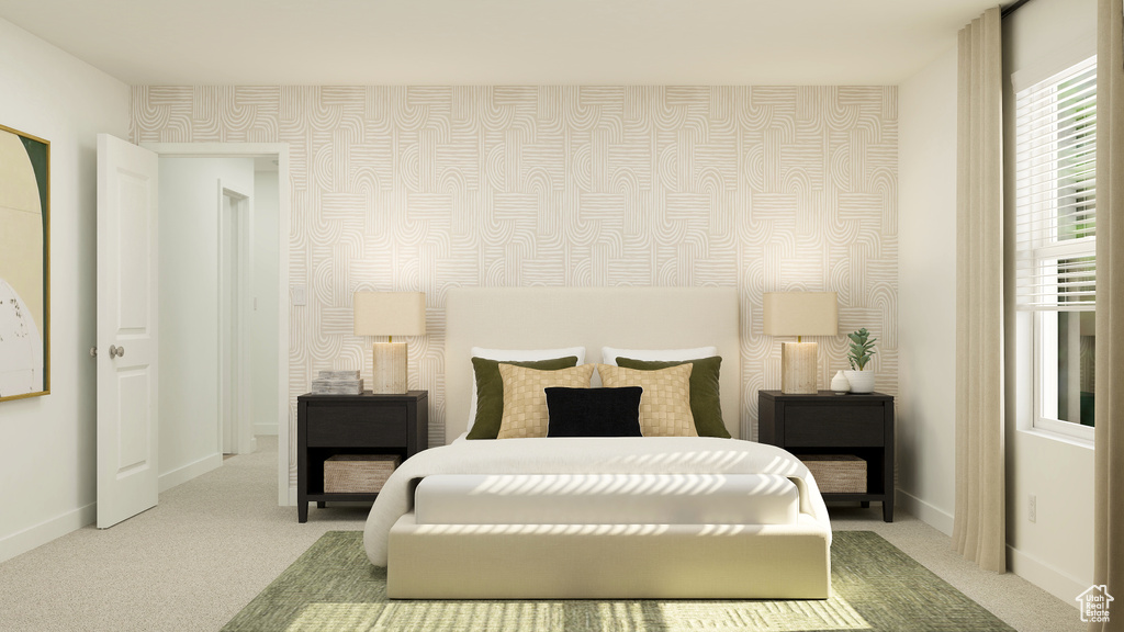 Bedroom featuring baseboards and light colored carpet