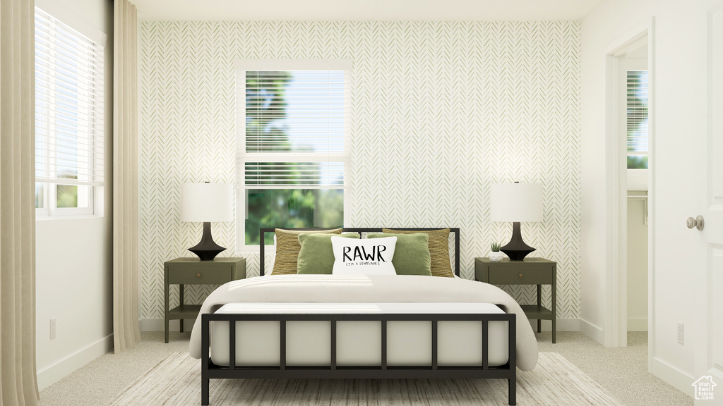 Carpeted bedroom with baseboards and an accent wall