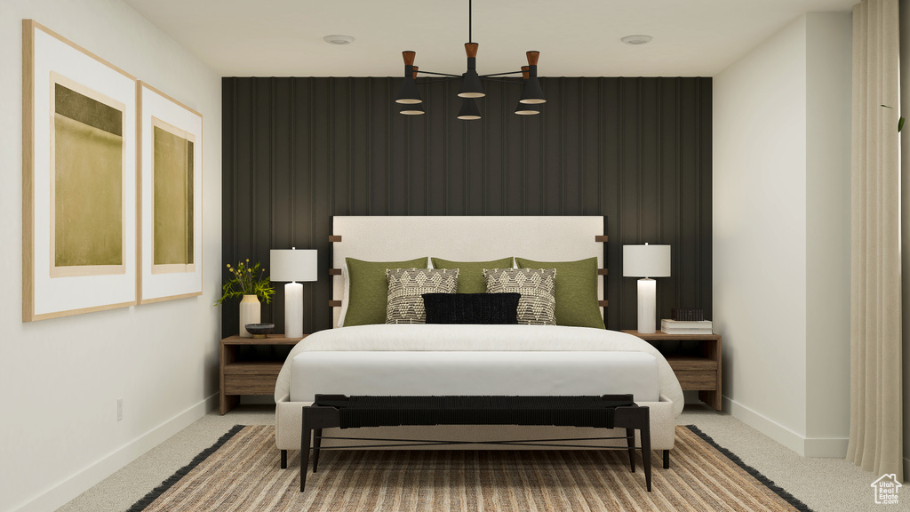Bedroom with baseboards, an accent wall, and carpet