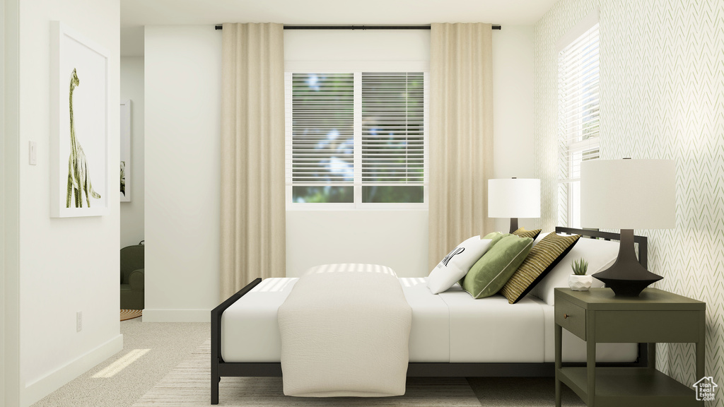Bedroom featuring carpet floors, baseboards, and wallpapered walls