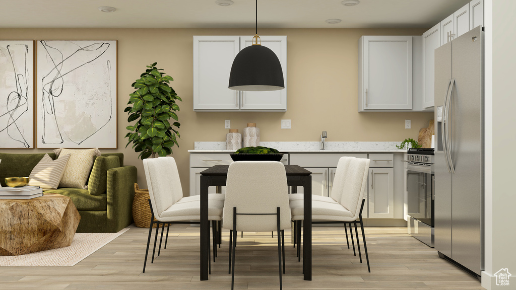 Dining space with light wood finished floors