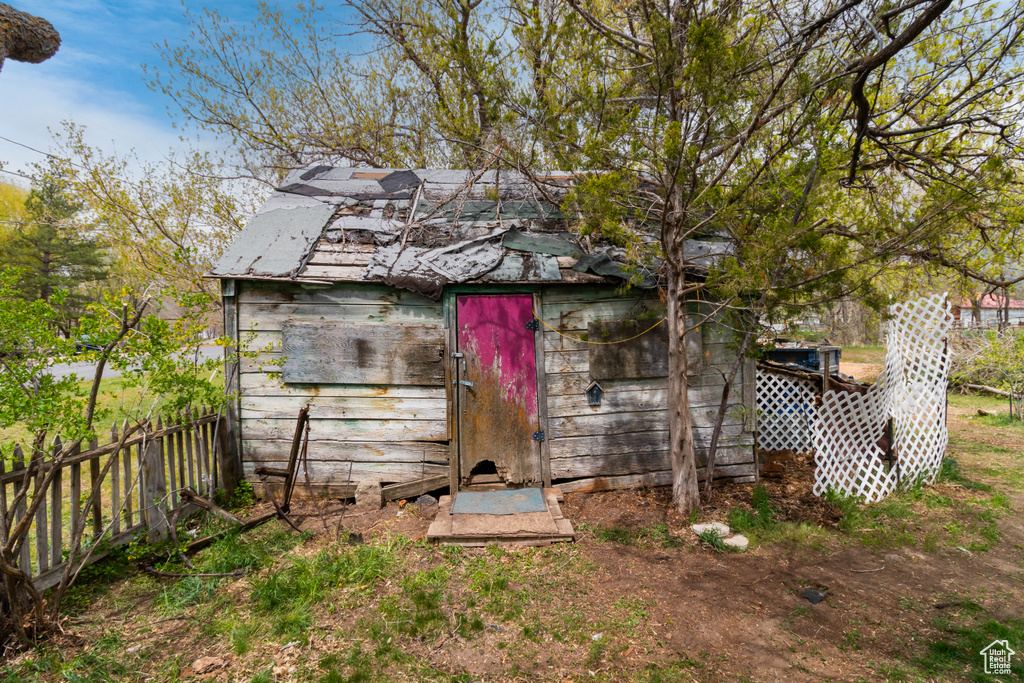 View of shed with fence
