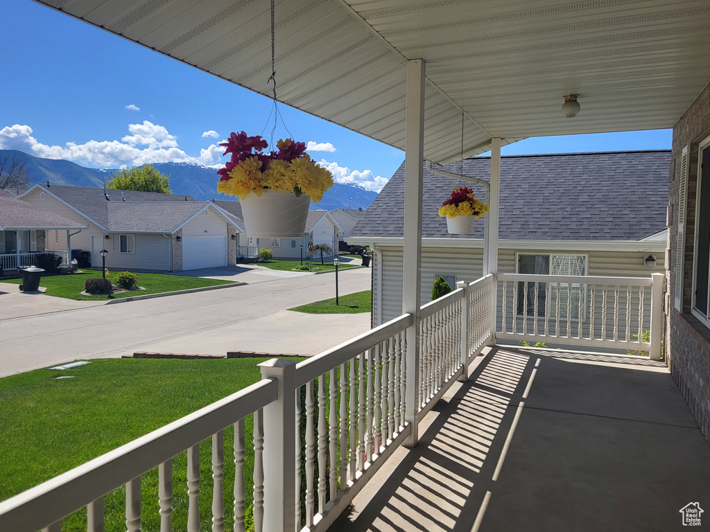Balcony featuring a porch and a residential view