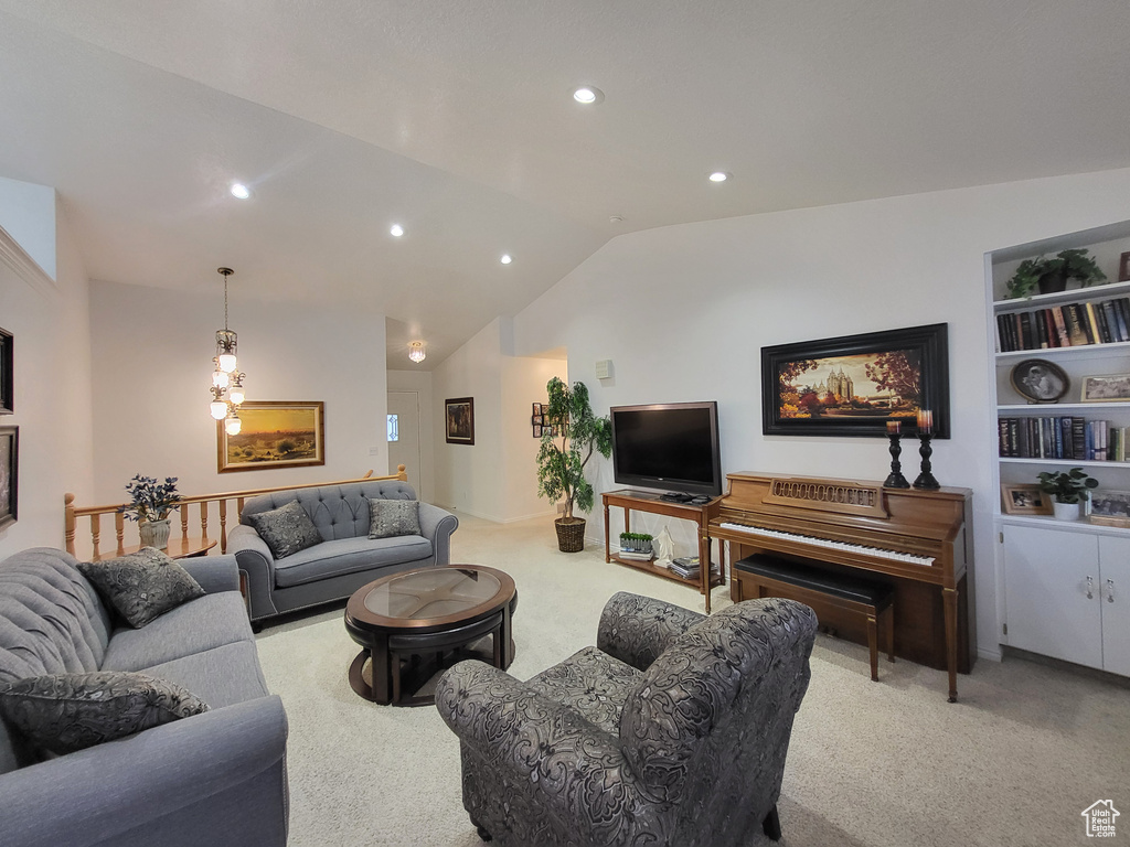 Living area featuring recessed lighting, lofted ceiling, and carpet