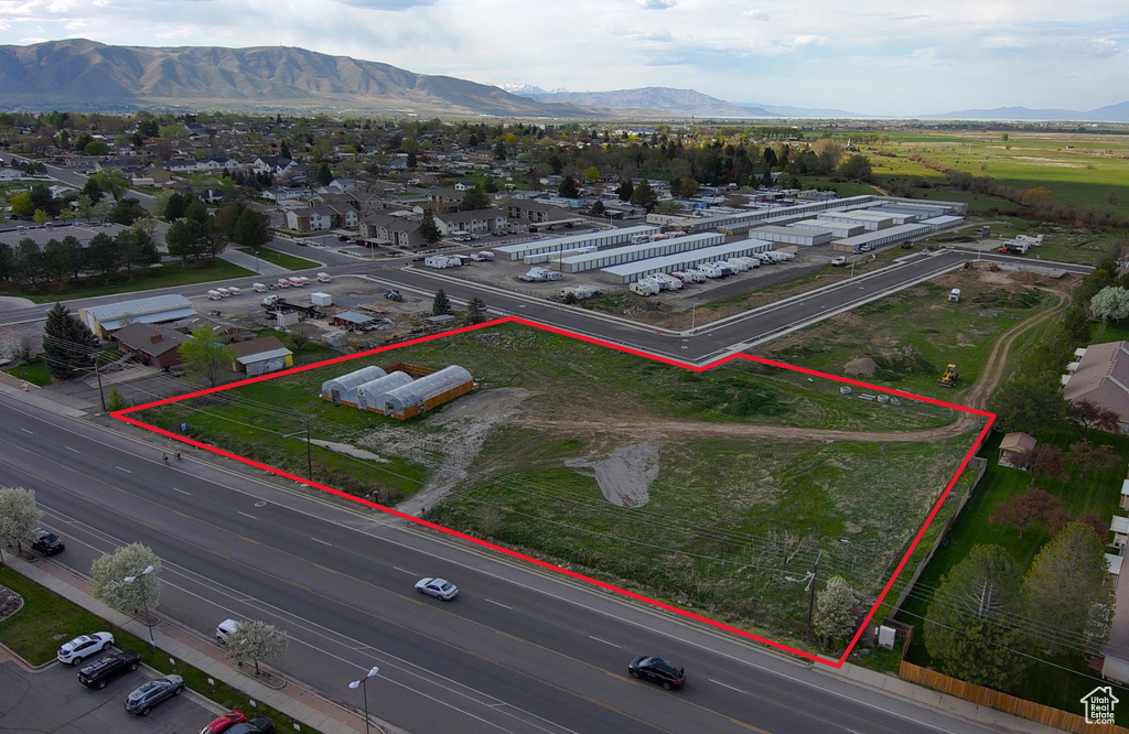 Birds eye view of property with a mountain view