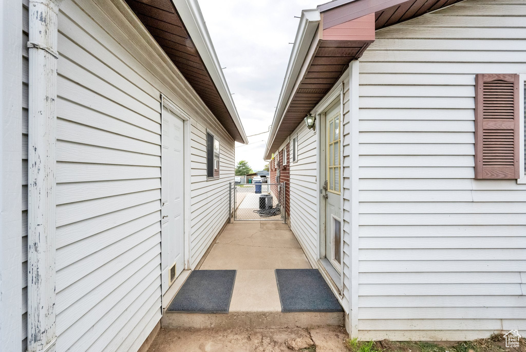 View of side of property with a gate