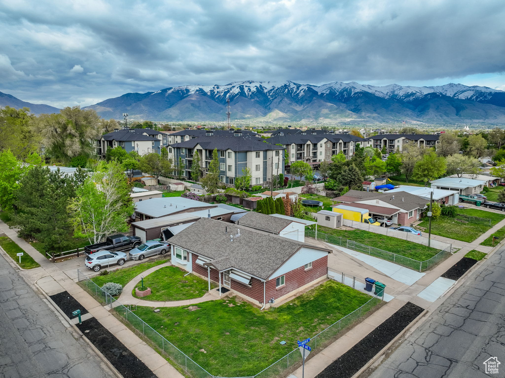 Birds eye view of property with a residential view and a mountain view