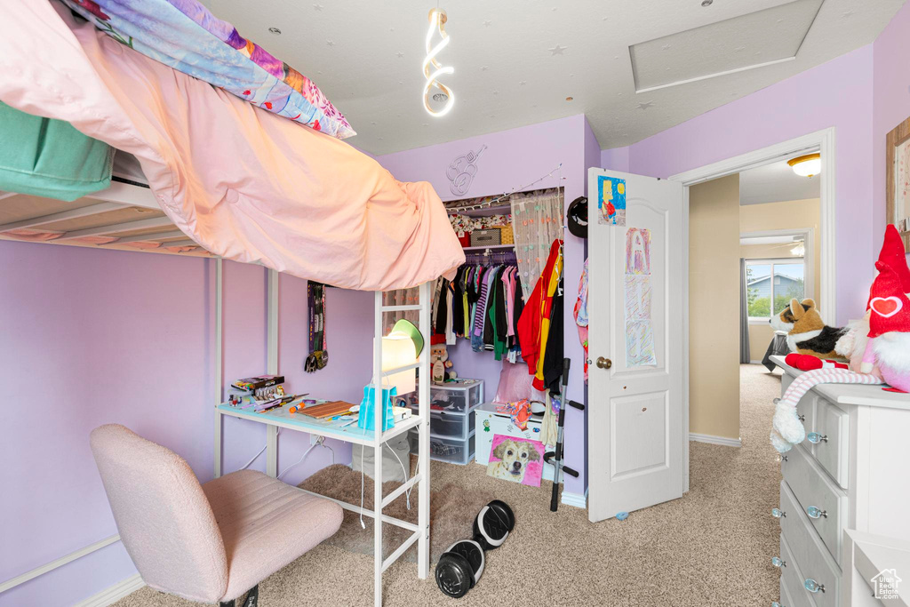 Bedroom with carpet floors, attic access, and baseboards