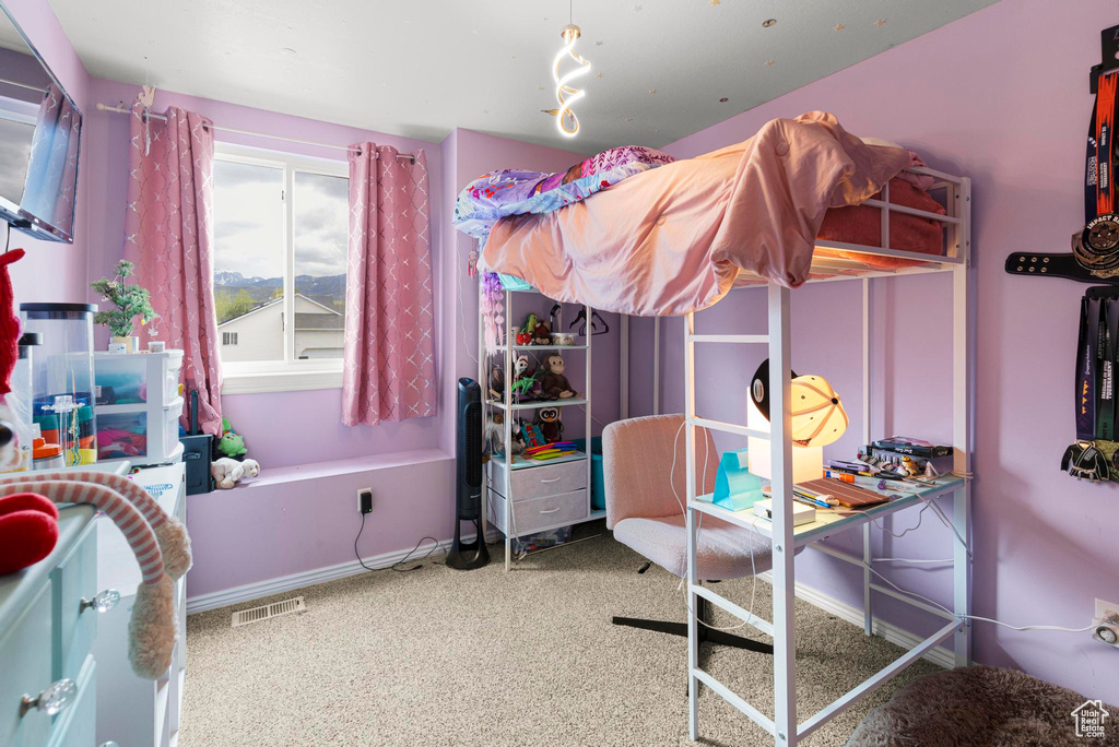 Bedroom featuring carpet floors, baseboards, and visible vents