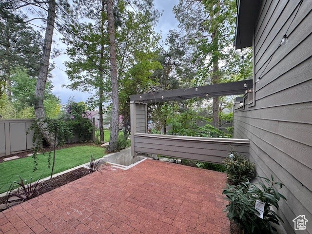 View of patio / terrace featuring fence