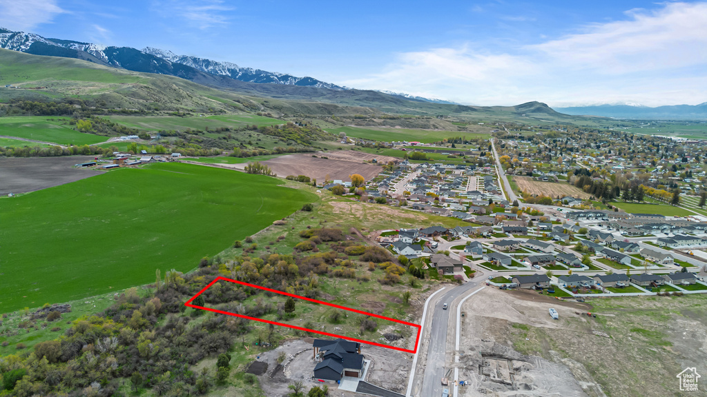 Drone / aerial view with a residential view, a mountain view, and view of golf course