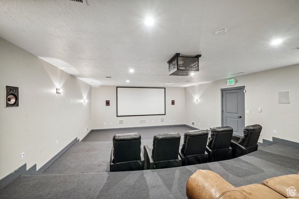 Home theater room featuring baseboards and recessed lighting