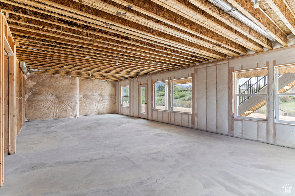 Miscellaneous room featuring concrete floors and a wealth of natural light