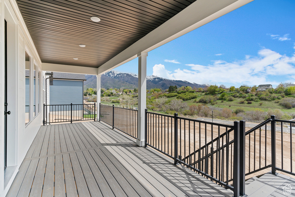 Wooden deck featuring a mountain view
