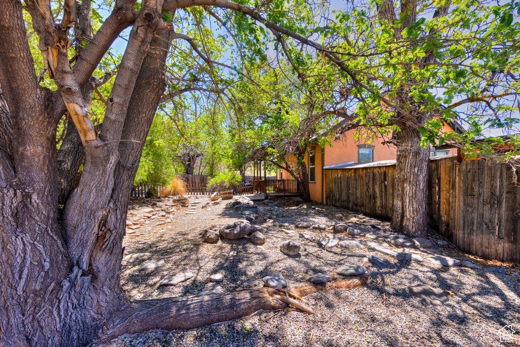 View of yard featuring fence