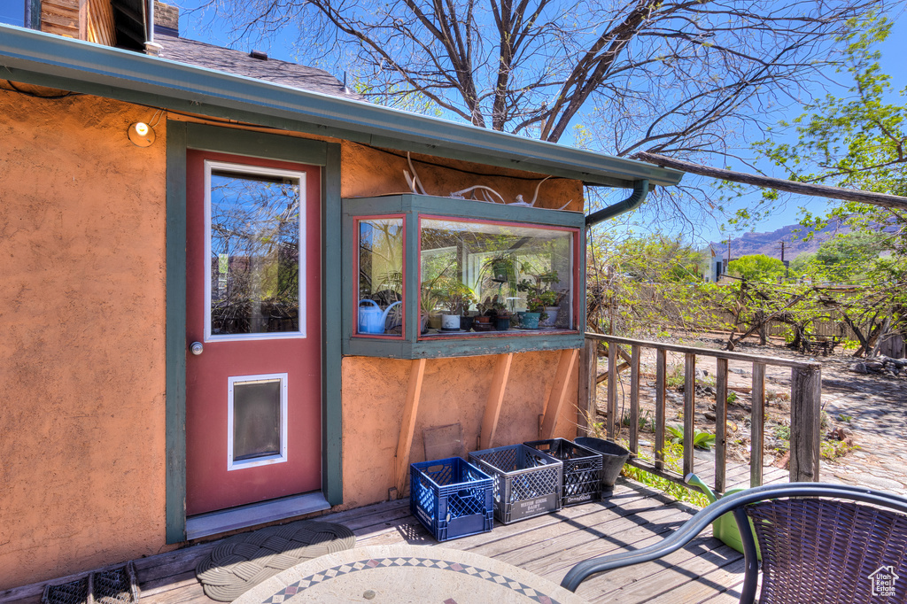 Entrance to property with stucco siding
