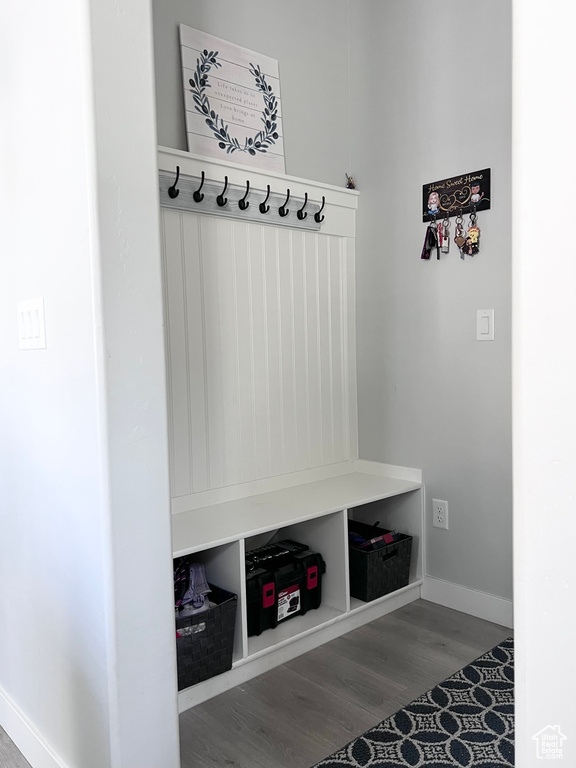 Mudroom featuring baseboards and wood finished floors