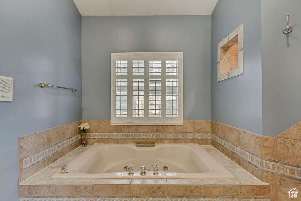 Bathroom featuring a tub with jets