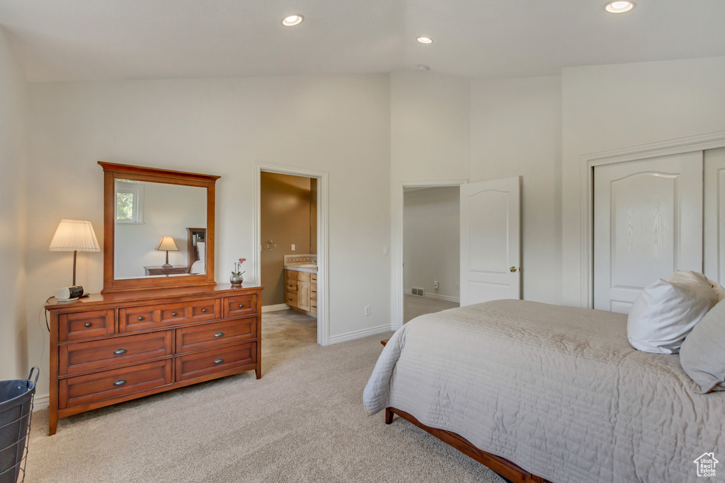Bedroom featuring light carpet, baseboards, ensuite bathroom, high vaulted ceiling, and recessed lighting