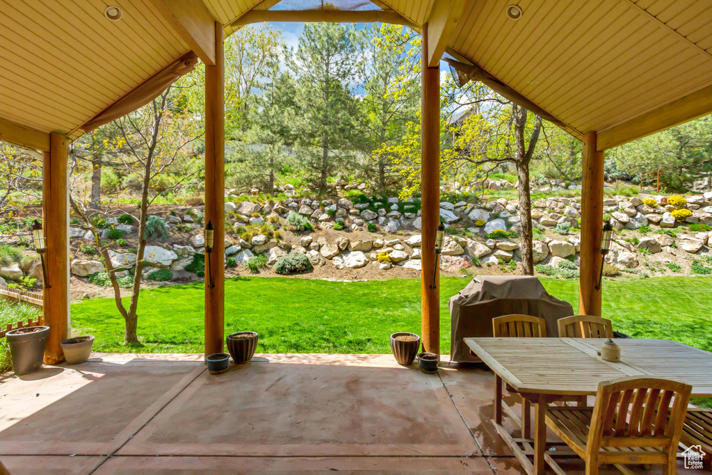 View of patio featuring area for grilling