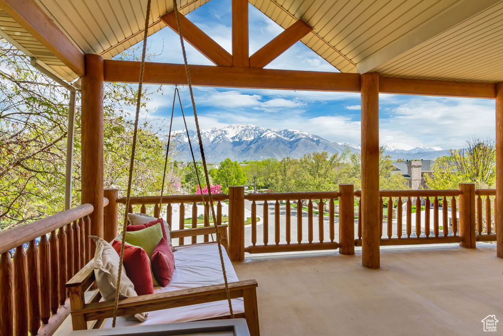 Wooden terrace featuring a mountain view