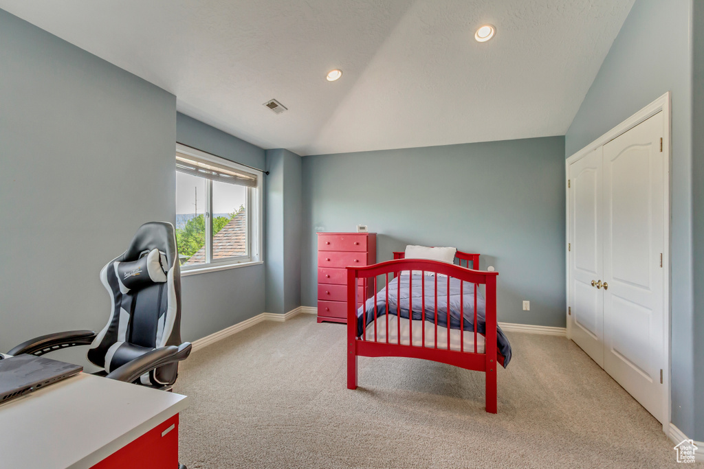 Carpeted bedroom featuring baseboards, lofted ceiling, recessed lighting, and visible vents