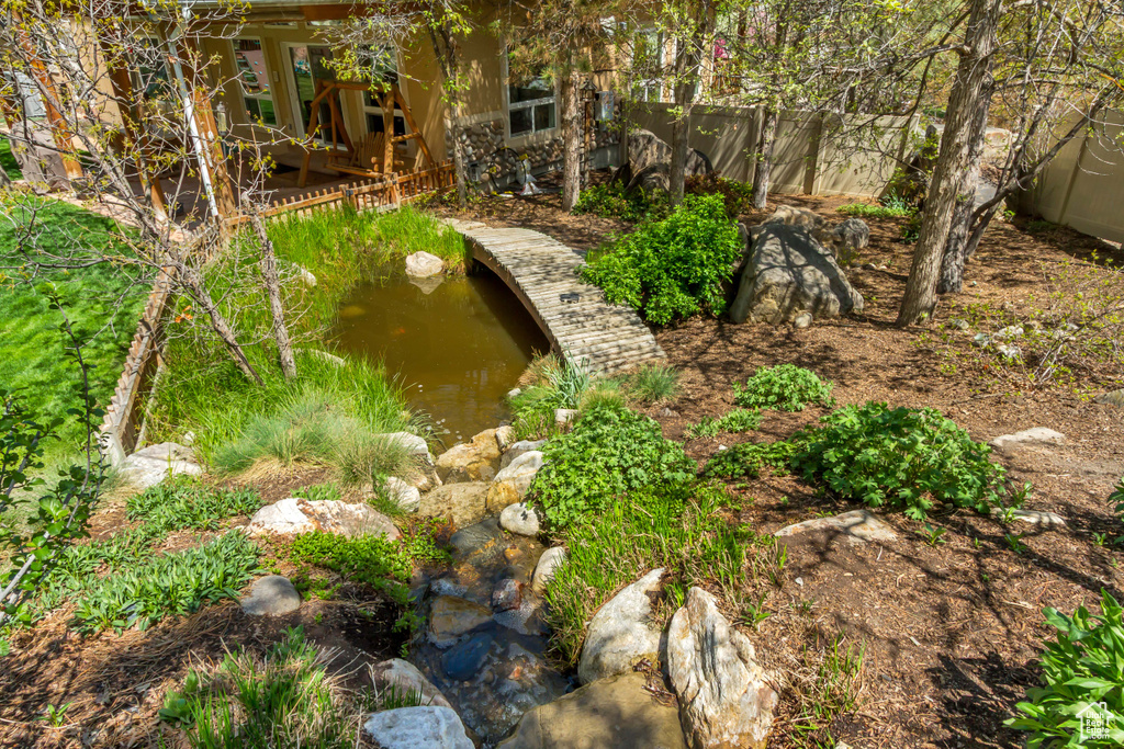 View of yard featuring a garden pond