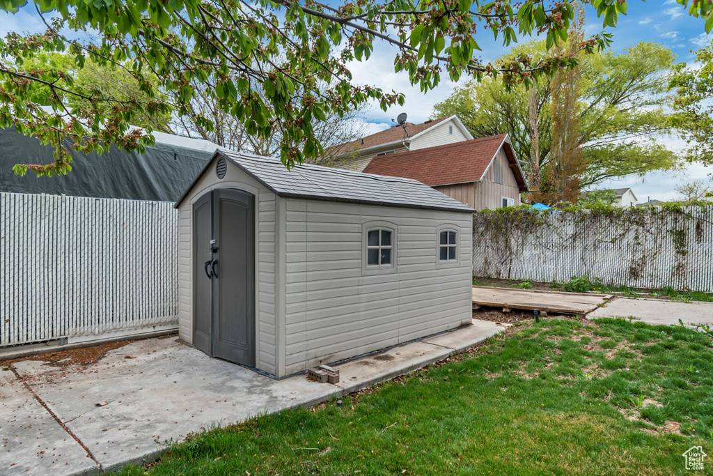 View of shed with fence