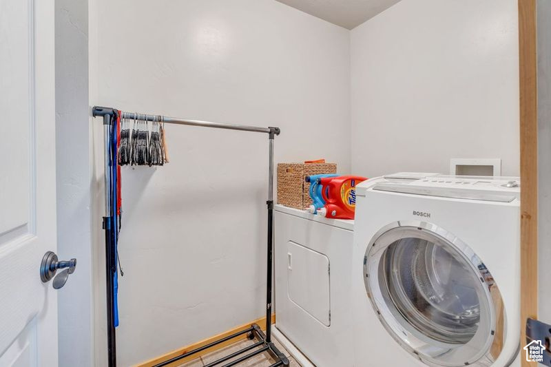 Laundry room featuring laundry area and washer and clothes dryer