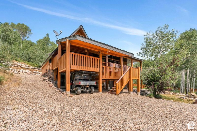 Rear view of house with stairs