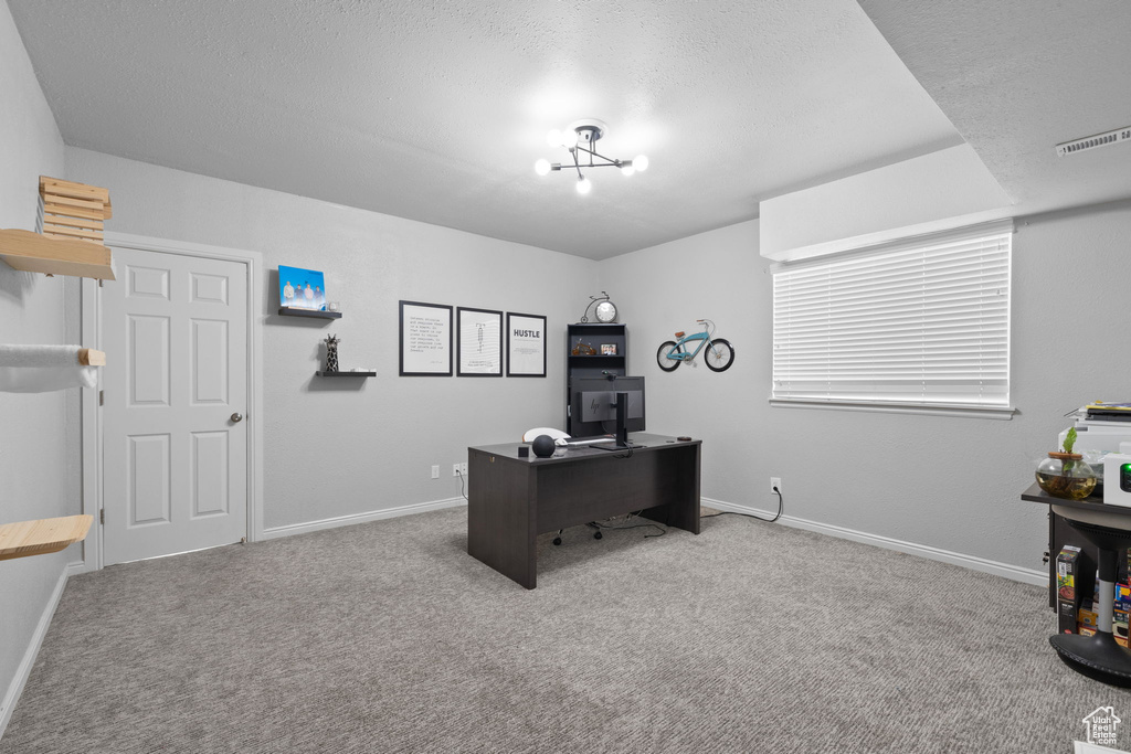 Office space featuring baseboards and carpet floors