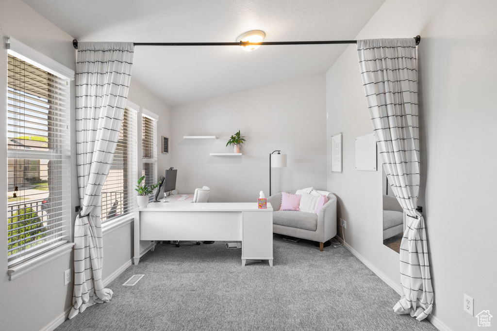 Living area with carpet and baseboards