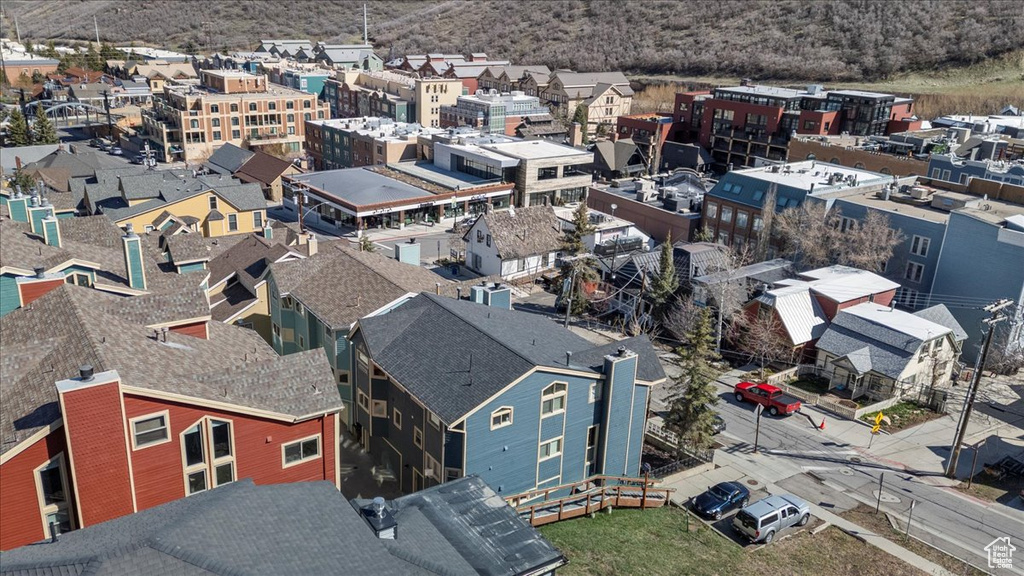 Birds eye view of property with a residential view and a mountain view