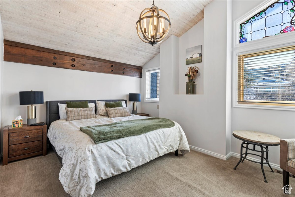 Bedroom featuring lofted ceiling, baseboards, wood ceiling, carpet flooring, and a notable chandelier