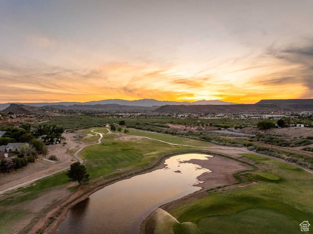 Exterior space with view of golf course and a water and mountain view